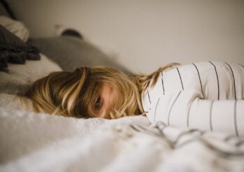 woman lying on bed